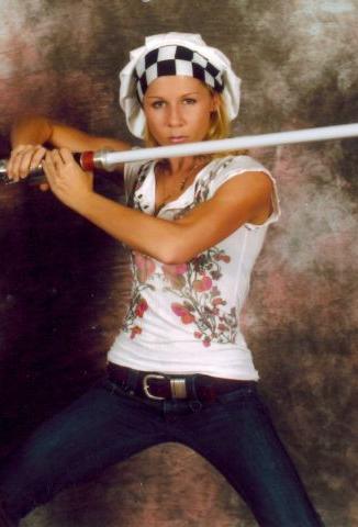 Gigi Edgley with a Lightsaber